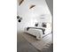 Comfortable main bedroom featuring soft carpet, cozy bedding, and natural light at 840 S Pennsylvania St, Denver, CO 80209
