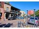 The photo captures the vibrant Old South Pearl Street in Denver, featuring shops, cars, and people enjoying the day at 840 S Pennsylvania St, Denver, CO 80209