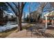 Spacious deck with seating area, overlooking a large backyard with trees and a trampoline at 6941 S Poplar Way, Centennial, CO 80112