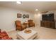 Finished basement with seating area, TV and plenty of natural light at 6941 S Poplar Way, Centennial, CO 80112