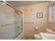 Clean bathroom with shower/tub combo, tile flooring and updated fixtures at 6941 S Poplar Way, Centennial, CO 80112