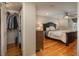 Spacious bedroom with a large closet and hardwood floors at 6941 S Poplar Way, Centennial, CO 80112