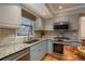 Kitchen features granite countertops and stainless steel appliances at 6941 S Poplar Way, Centennial, CO 80112