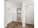 This bathroom features a glass shower, wood floors, and a closet at 8807 Sedalia St, Commerce City, CO 80022