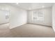 Spacious bedroom with plush carpeting, a window, and a door to a walk-in closet at 8807 Sedalia St, Commerce City, CO 80022