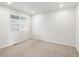 Bright, carpeted bedroom with a large window at 8807 Sedalia St, Commerce City, CO 80022