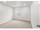 This bedroom features neutral paint, plush carpet, and recessed lighting at 8807 Sedalia St, Commerce City, CO 80022