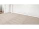 This bedroom features neutral paint, plush carpet, and a door at 8807 Sedalia St, Commerce City, CO 80022