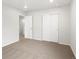 Bedroom featuring sliding closet doors, carpet, and an open doorway at 8807 Sedalia St, Commerce City, CO 80022
