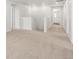 Upstairs hallway with neutral carpet provides access to multiple rooms at 8807 Sedalia St, Commerce City, CO 80022