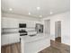 Kitchen with granite counters, a center island, stainless appliances, and a pantry at 8807 Sedalia St, Commerce City, CO 80022