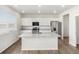 Bright kitchen with granite counters, stainless steel appliances, and a center island at 8807 Sedalia St, Commerce City, CO 80022