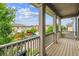 Charming balcony offering views of the neighborhood and surrounding trees on a clear day at 11466 E 27Th Ave, Denver, CO 80238