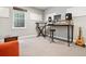 Finished basement area converted into a music room with instruments and neutral decor at 11466 E 27Th Ave, Denver, CO 80238
