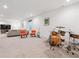 Spacious basement with seating area, drum set, musical instruments, and stylish decor at 11466 E 27Th Ave, Denver, CO 80238
