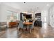 Dining room with table and chairs situated close to a modern kitchen at 11466 E 27Th Ave, Denver, CO 80238