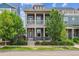 Charming two-story home boasts a cozy front porch, complemented by verdant landscaping and beautiful curb appeal at 11466 E 27Th Ave, Denver, CO 80238