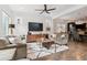 Cozy living room featuring hardwood floors, comfortable seating, and an open layout at 11466 E 27Th Ave, Denver, CO 80238