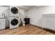 Basement laundry and toilet room featuring a new vanity, a washing machine and a dryer at 5914 S Kearney St, Centennial, CO 80111