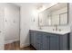 Elegant bathroom with double vanity, modern fixtures, and a view of the shower at 5914 S Kearney St, Centennial, CO 80111