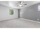 Spacious bedroom with neutral carpet, a ceiling fan, and natural lighting at 5914 S Kearney St, Centennial, CO 80111