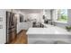 Spacious kitchen with stainless steel appliances, white countertops, and a breakfast bar, seamlessly connected to the dining area at 5914 S Kearney St, Centennial, CO 80111