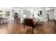 Open concept living room with hardwood floors and natural light, seamlessly connecting to the dining area at 5914 S Kearney St, Centennial, CO 80111