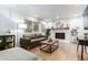 Inviting living room with modern fireplace, stylish decor, and plenty of natural light at 5914 S Kearney St, Centennial, CO 80111