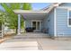 Covered back patio with a grill and space to enjoy the outdoors at 1118 S Duquesne Cir, Aurora, CO 80018