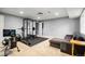 Finished basement area with home gym and space for a sofa at 1118 S Duquesne Cir, Aurora, CO 80018