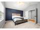 Bedroom with a high ceiling, a king size bed, and soft grey carpet flooring at 1118 S Duquesne Cir, Aurora, CO 80018