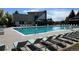Community pool with lounge chairs and lifeguard at 1118 S Duquesne Cir, Aurora, CO 80018