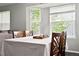 Dining area featuring large windows, lots of light, and comfortable seating at 1118 S Duquesne Cir, Aurora, CO 80018