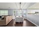 Open concept dining room with large windows, and direct connection to the kitchen at 1118 S Duquesne Cir, Aurora, CO 80018