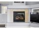 Cozy fireplace with tile surround and mantel at 1118 S Duquesne Cir, Aurora, CO 80018