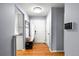 Entryway with hardwood floors, coat rack, and modern lighting at 1118 S Duquesne Cir, Aurora, CO 80018