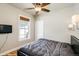 Cozy bedroom featuring a ceiling fan, a window, and a comfortable bed, offering a relaxing retreat at 284 S Lafayette St, Denver, CO 80209