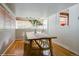 Spacious dining room features hardwood floors, large windows, and stylish decor, creating a warm ambiance at 284 S Lafayette St, Denver, CO 80209