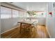 Bright dining room features hardwood floors, large windows, and a stylish table setting for Gathering gatherings at 284 S Lafayette St, Denver, CO 80209