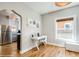 A cozy home office featuring hardwood floors, white desk, and ample natural light perfect for productivity at 284 S Lafayette St, Denver, CO 80209