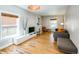 Bright living area featuring hardwood floors, fireplace and modern decor, creating a comfortable and stylish space at 284 S Lafayette St, Denver, CO 80209