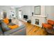 Open-concept living space with hardwood floors, fireplace, and comfortable seating, creating an inviting atmosphere at 284 S Lafayette St, Denver, CO 80209