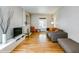 Inviting living room with hardwood floors, neutral walls, fireplace and comfortable seating perfect for relaxing at 284 S Lafayette St, Denver, CO 80209