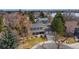 Aerial view of property showing lush landscaping, well-maintained grounds, and proximity to the lake at 8510 Independence Way, Arvada, CO 80005