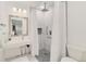 Modern bathroom with walk-in shower, tiled walls, and a sleek vanity at 8510 Independence Way, Arvada, CO 80005