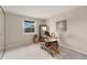 Bedroom staged with a desk and decorative shelving, offering a cozy workspace and natural light at 8510 Independence Way, Arvada, CO 80005