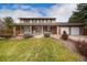 Attractive two-story home with a covered porch, brick accents, and a well-kept front yard at 8510 Independence Way, Arvada, CO 80005
