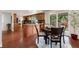 Bright eat-in kitchen features wooden cabinets, stainless steel appliances, and an island with granite countertops at 8510 Independence Way, Arvada, CO 80005