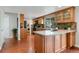 Spacious kitchen features wooden cabinets, granite countertops, tile backsplash, and stainless steel appliances at 8510 Independence Way, Arvada, CO 80005