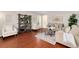 Cozy living room with hardwood floors, neutral furnishings, and ample natural light at 8510 Independence Way, Arvada, CO 80005
